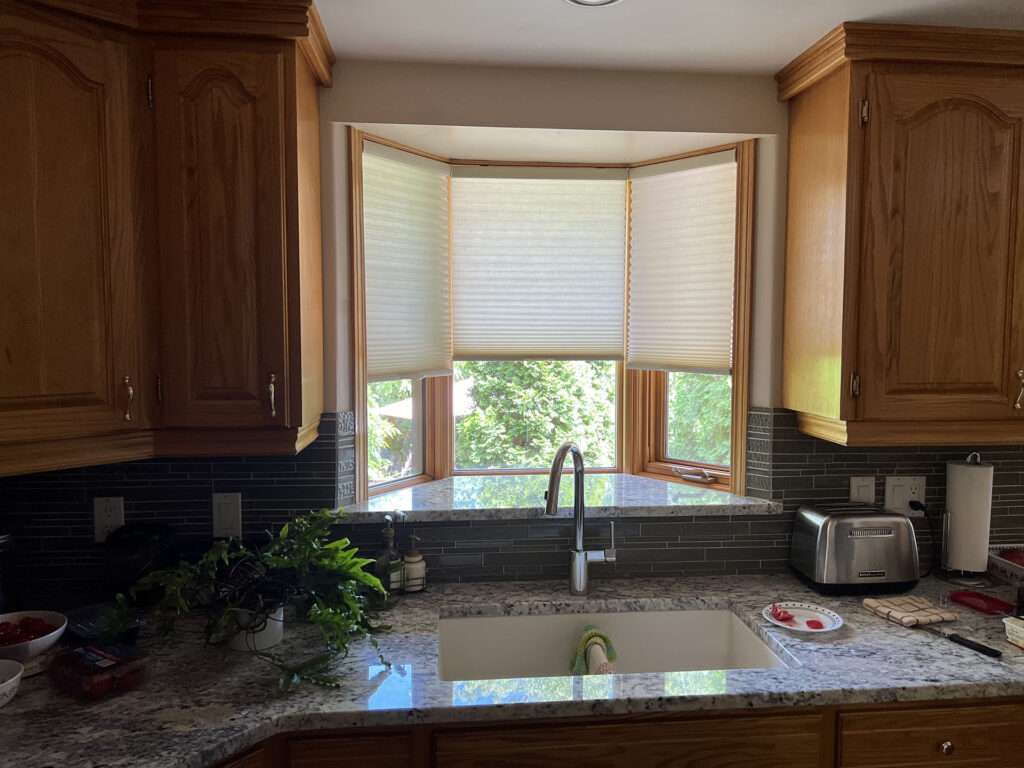 Bay Window with Cellular Blinds Above Kitchen Sink
