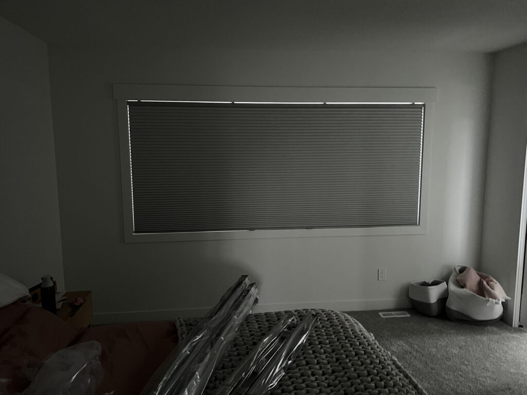 Closed Blackout Cellular Shade in Dark Bedroom