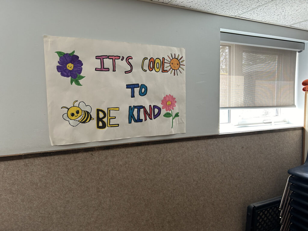 Commercial Space Wall with Kindness Poster and Window Shade