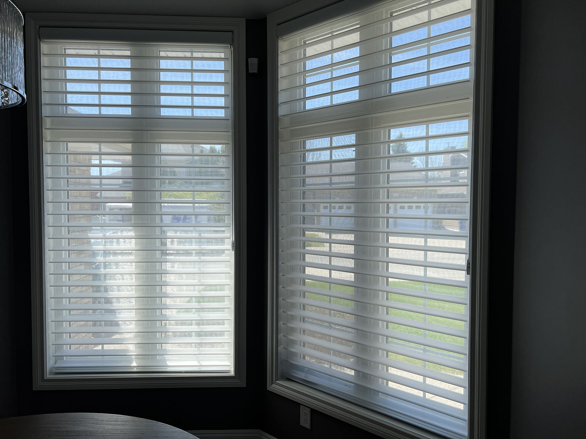 Dual Motorized Horizontal Sheer Shades in Corner Windows