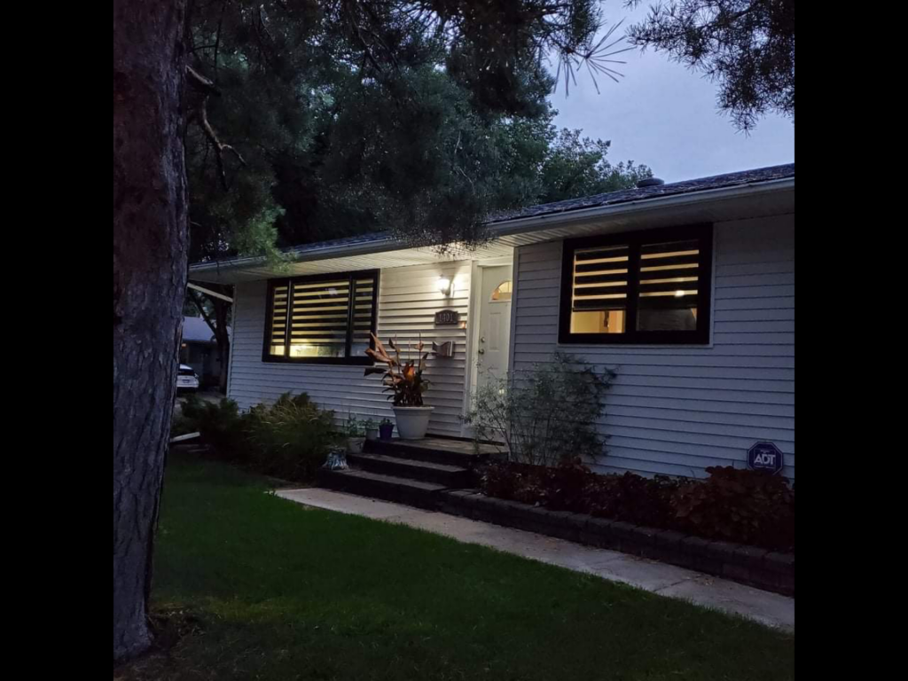 Exterior View of Home Windows with Motorized Zebra Shades