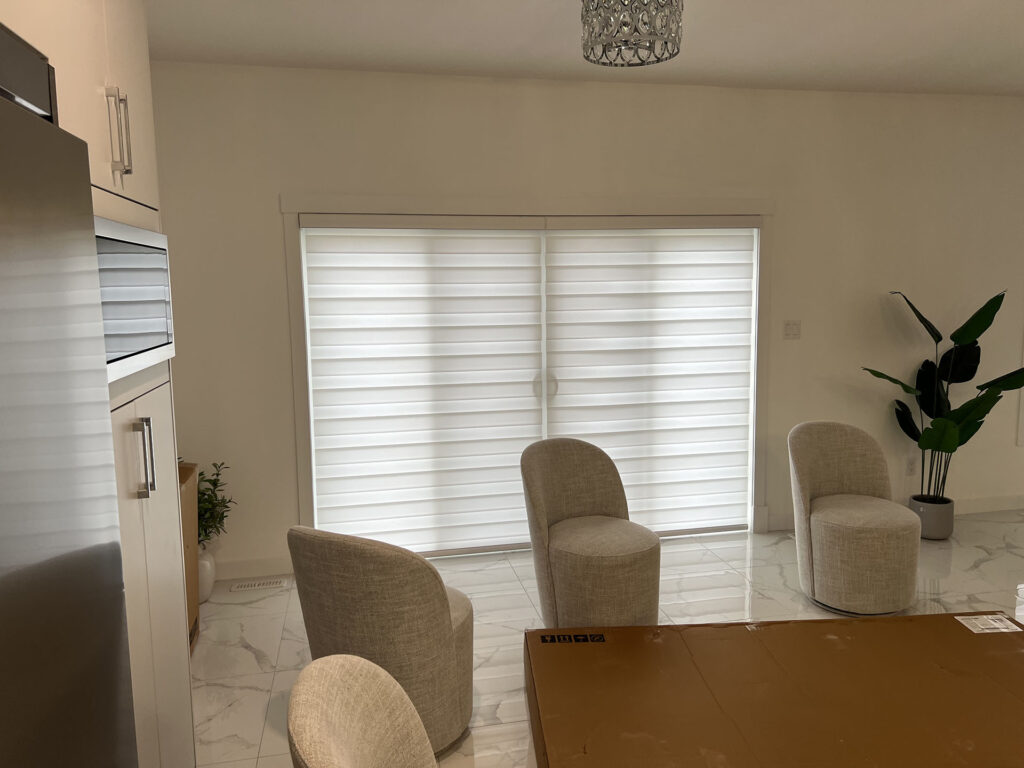 Large Sliding Patio Door Covered with White Horizontal Sheer Blinds