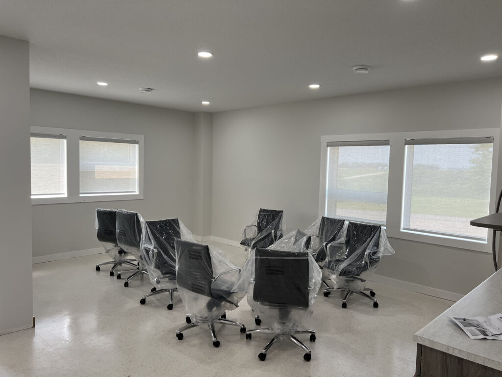 Modern Conference Room with Roller Shades and New Office Chairs
