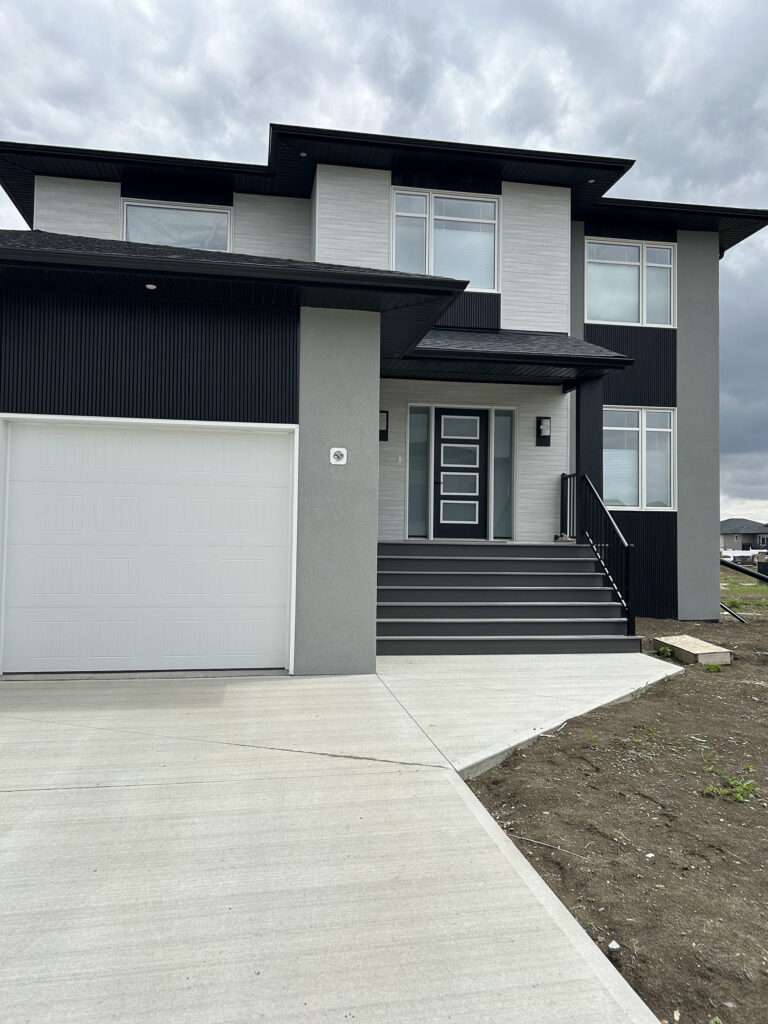 Modern Exterior of Newly Built Two-Story Home with Finished Windows