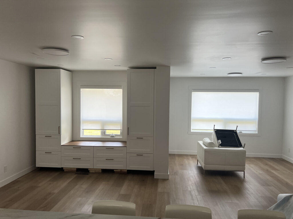 Modern Open Space Renovation with Built-In Cabinets and Roller Shades