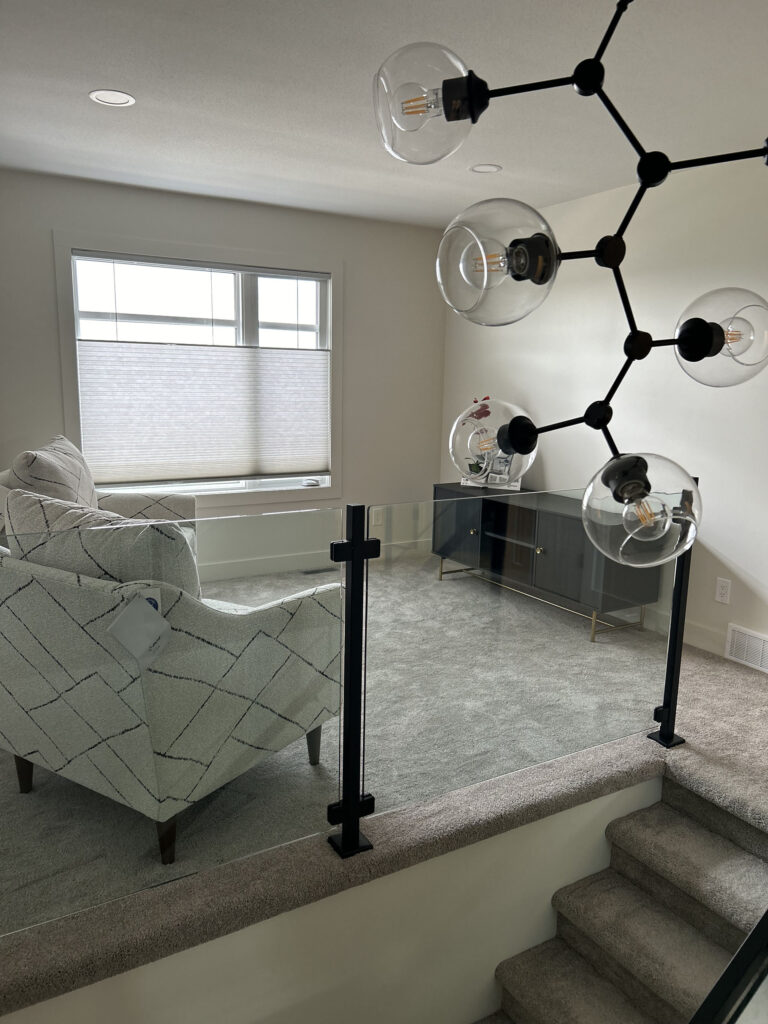Modern Upper Floor Landing with Glass Railing and Window Coverings