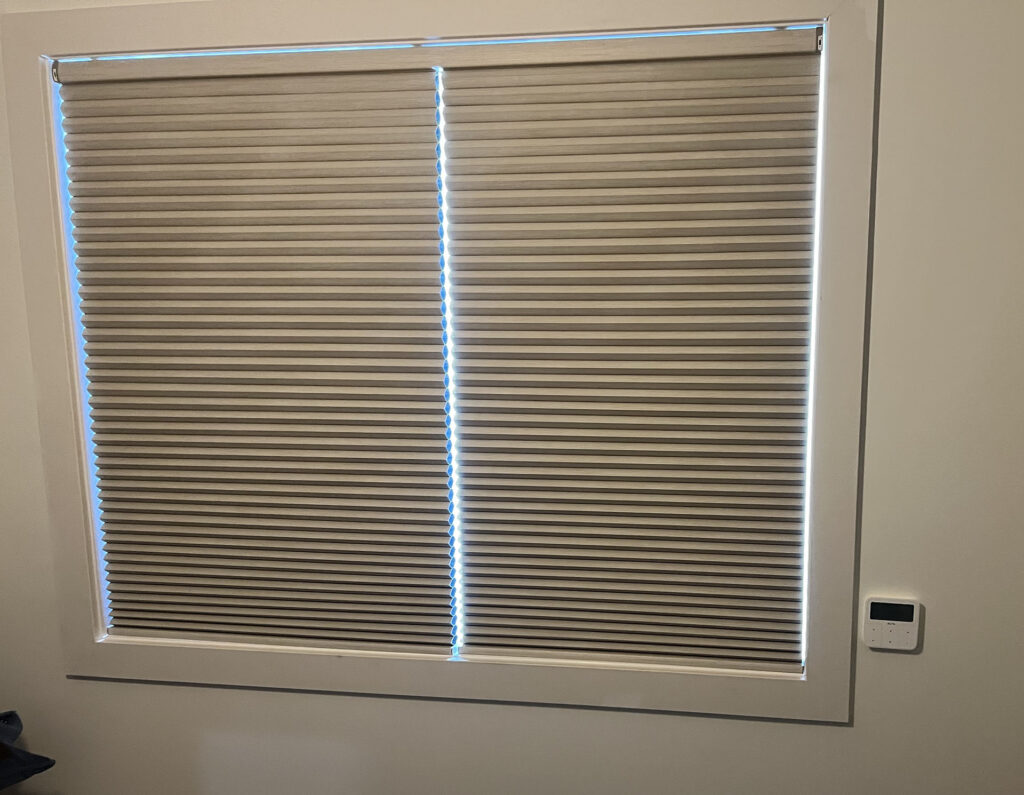 Motorized Cellular Shade with Wall-Mounted Remote Control