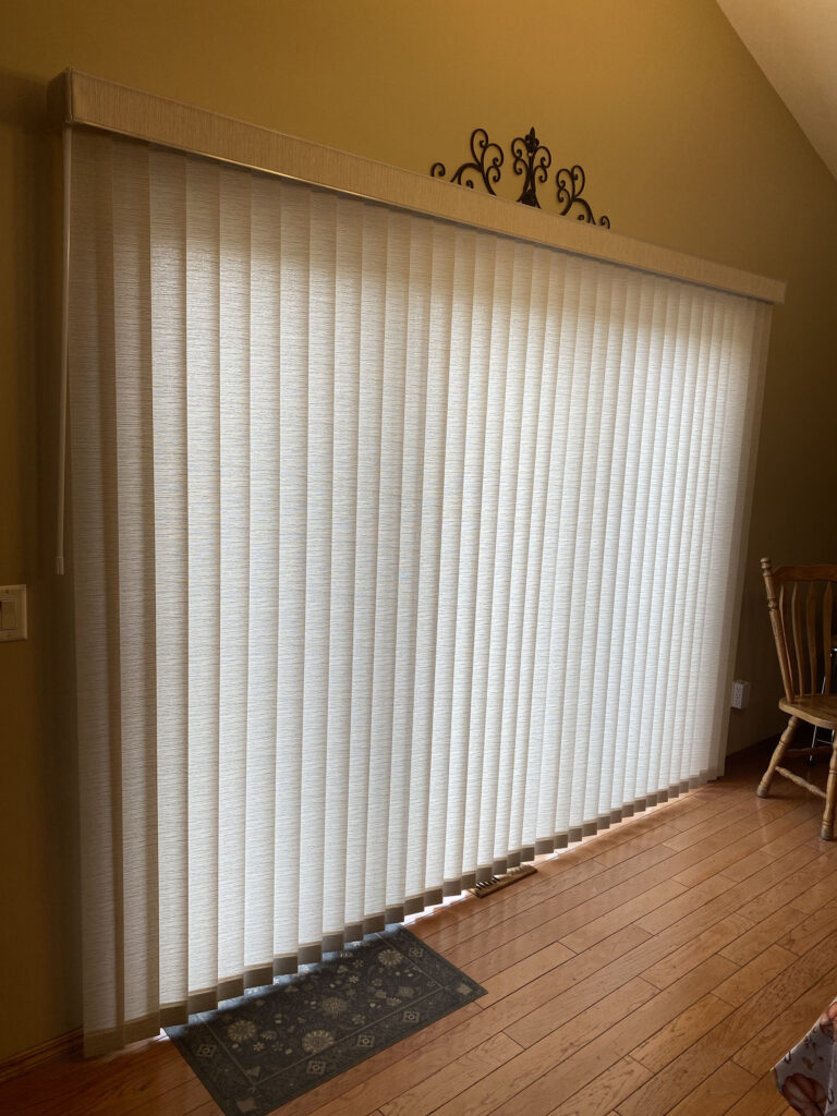 Patio Door Covered by Light Cream Vertical Sheer Drapes with Decorative Valance