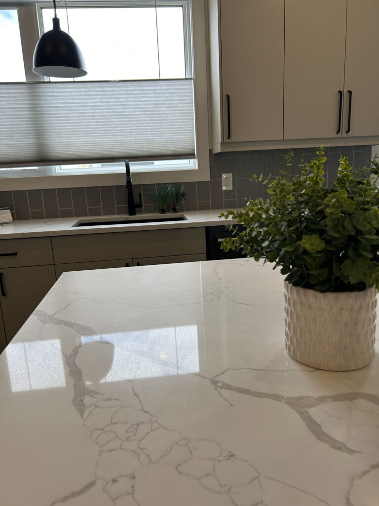 Quartz Island Countertop Facing Kitchen Window with Light-Filtering Shade