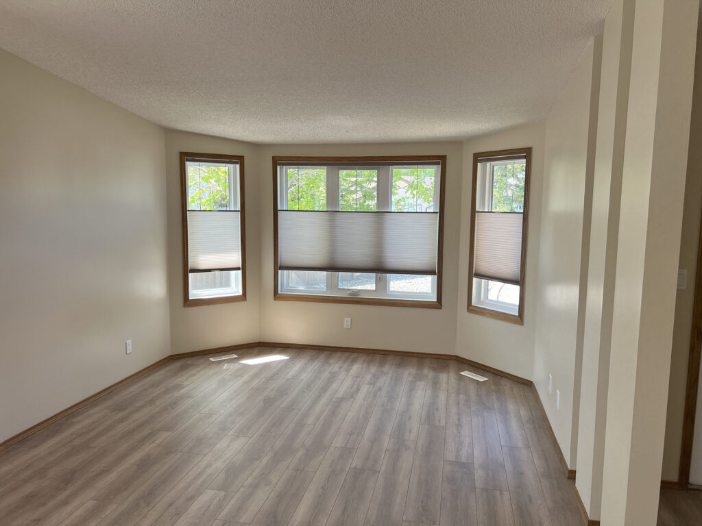 Renovated Bay Window Alcove with Wood Trim and Cellular Shades