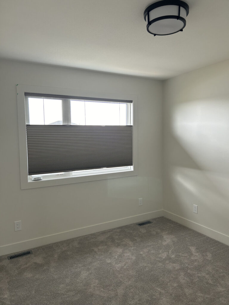 Unfurnished Bedroom Window with Semi-Translucent Cellular Shade