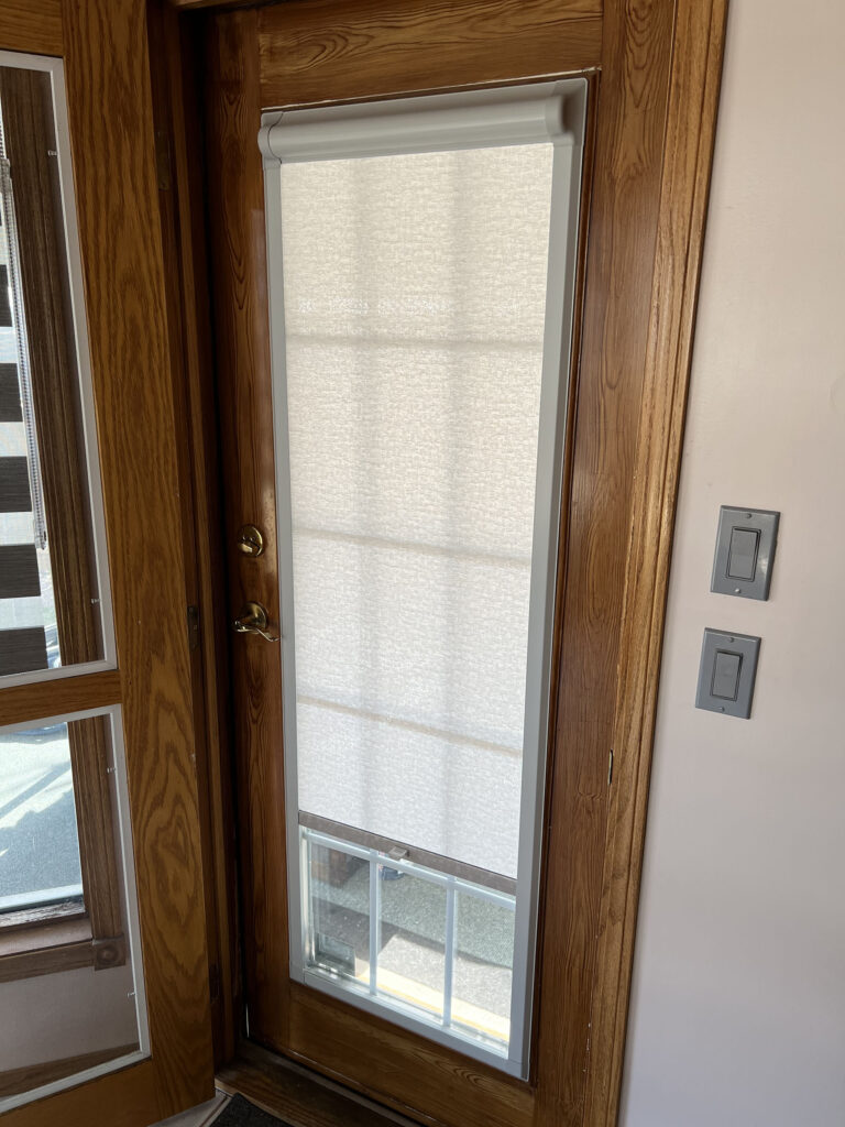 Wood-Framed Glass Door with Integrated Light-Filtering Shade